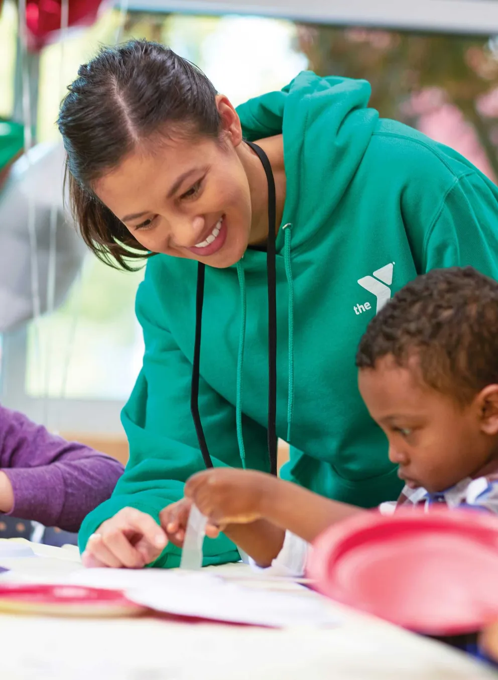 camp counselor crafting with kids