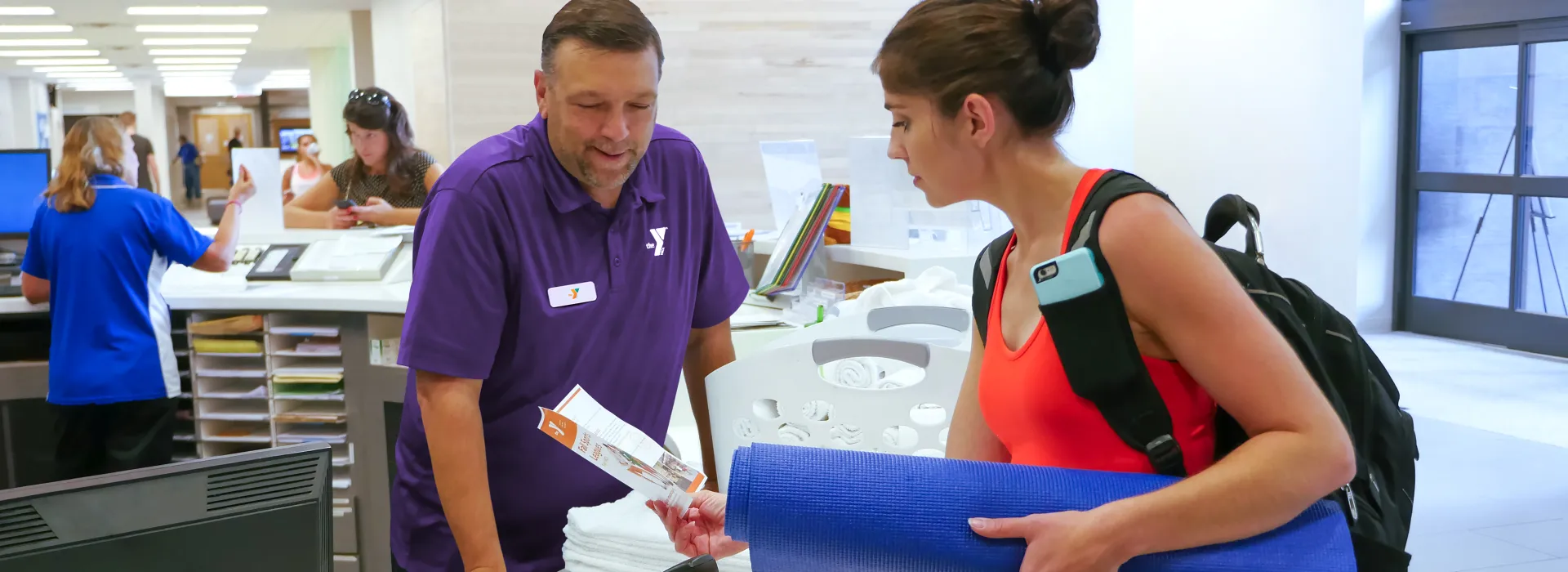 member services staff helping a member